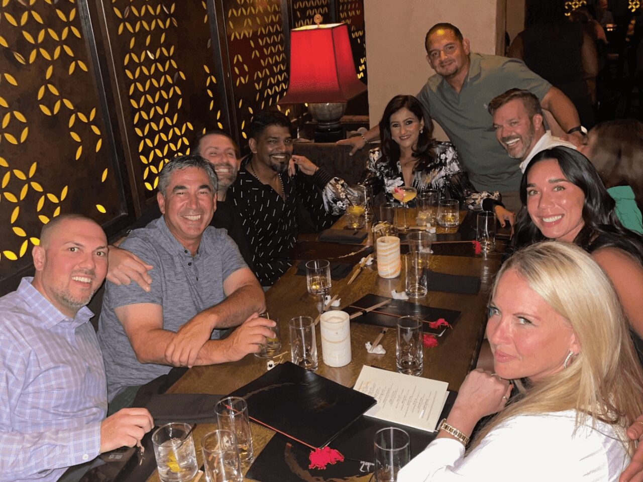 Group of friends enjoying dinner at a cozy restaurant.