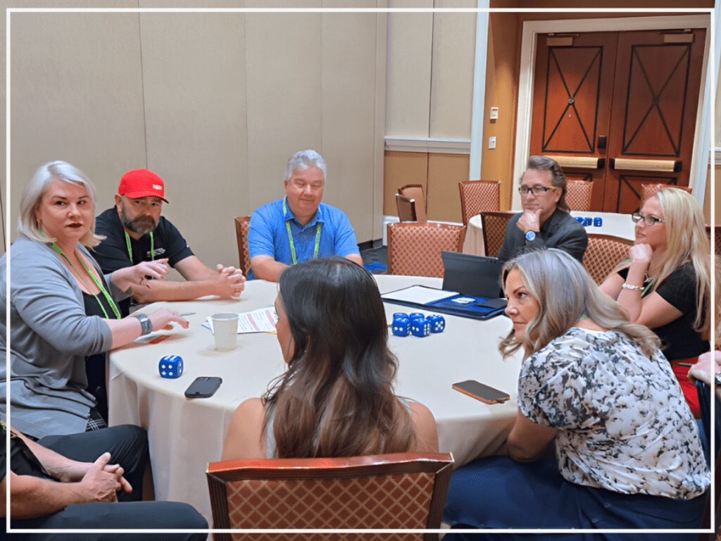 People engaged in a lively board game session around a table.
